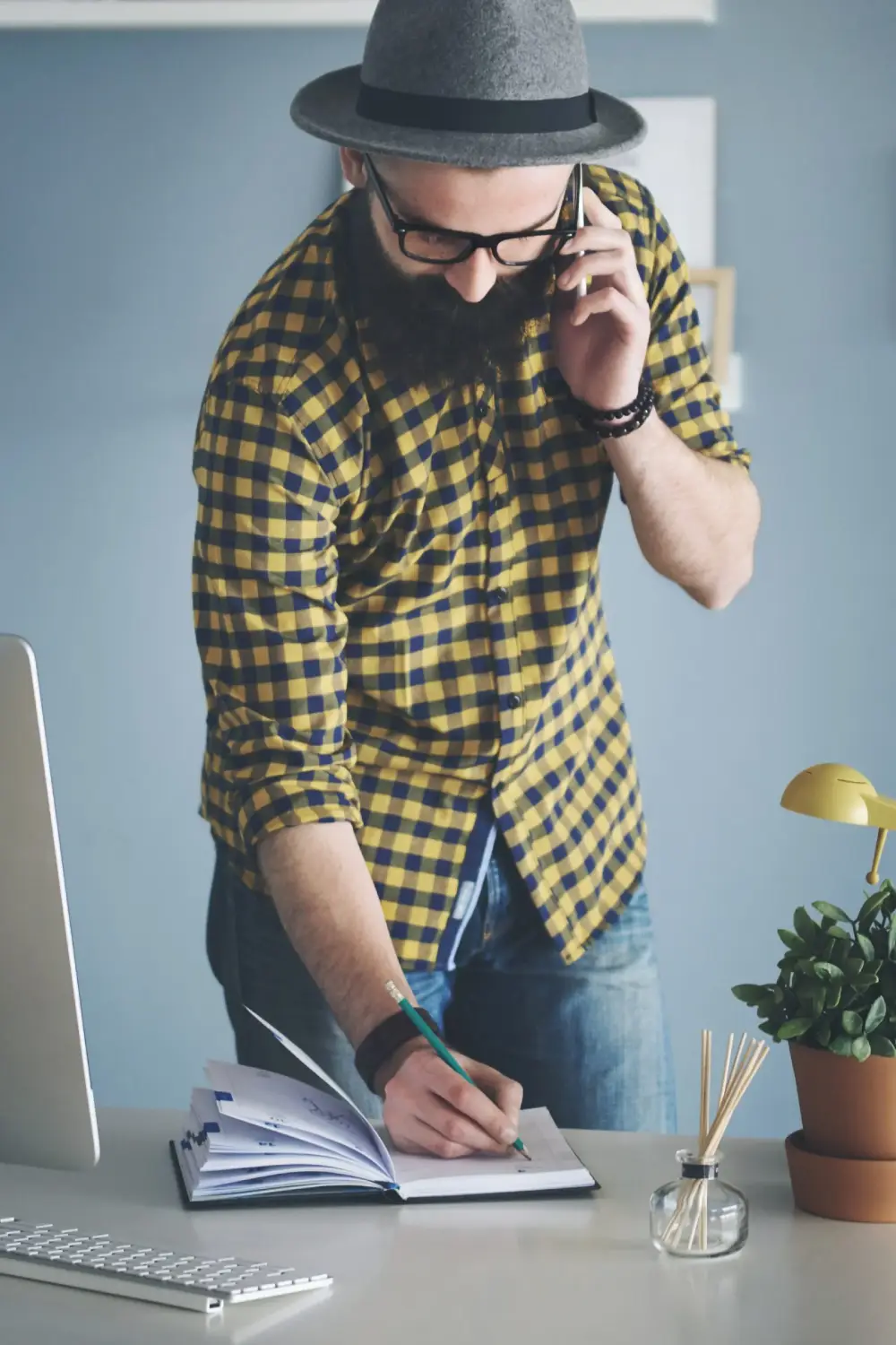 young-man-booking-meetings-through-the-phone